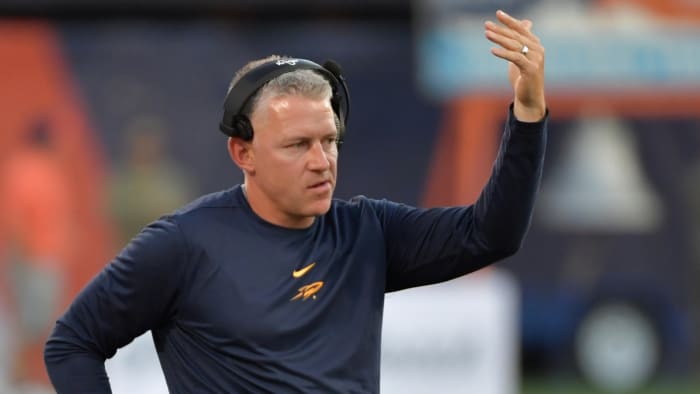 Sep 2, 2023; Champaign, Illinois, USA; Toledo Rockets head coach Jason Candle directs his players during the first half against the Illinois Fighting Illini at Memorial Stadium.
